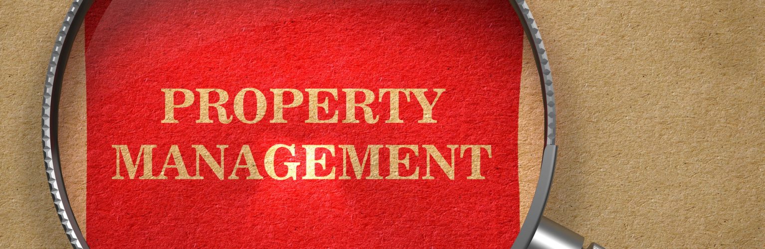 Property Management. Magnifying Glass on Old Paper